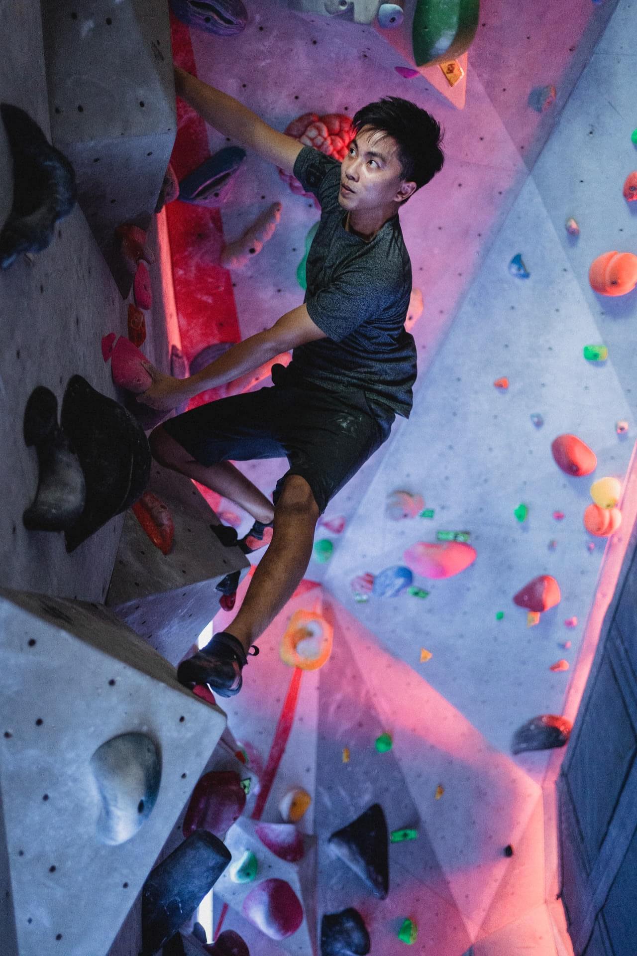 A creative crew climbs a climbing wall